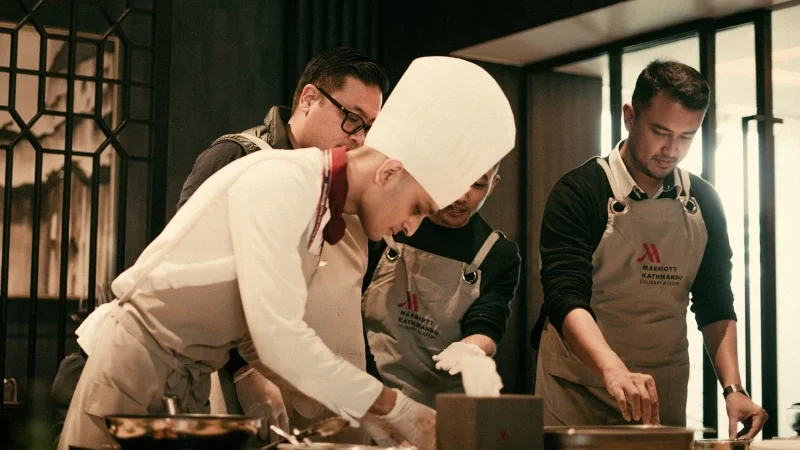 Chefs working in a restaurant kitchen, commercial rodent control in Buffalo NY