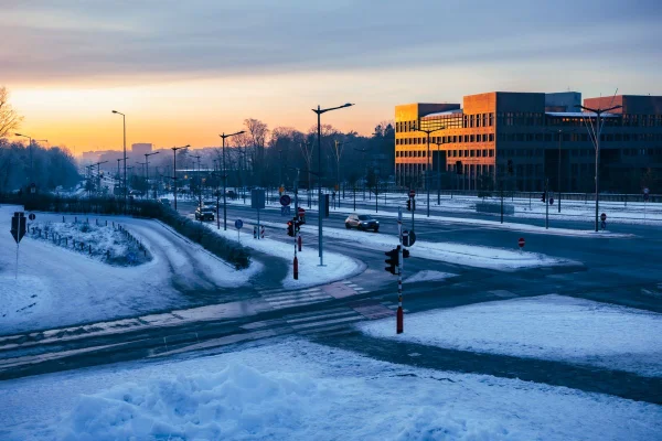 Snowy city street at sunset in winter, Erie County NY